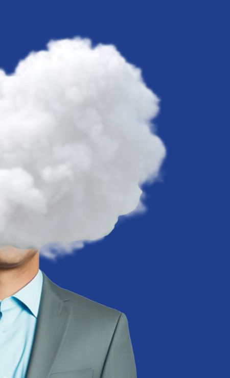 Business professional with cloud imagery representing cloud security and data protection against cybersecurity risks.
